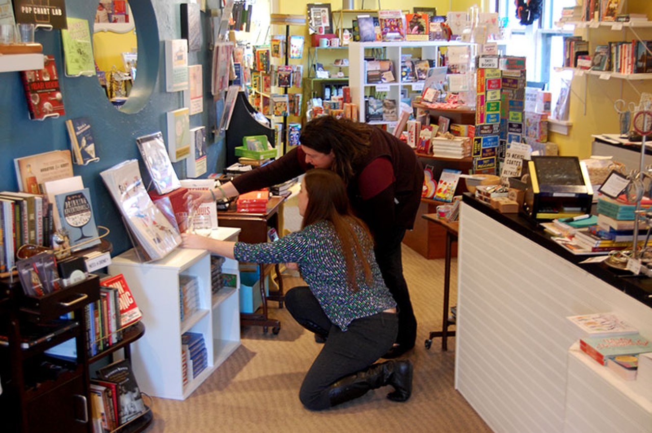 Opened in 2014, The Novel Neighbor offers a variety of classes and events in addition to books. Here, Saltsman and employee Lauren Lane examine one of the books on display.