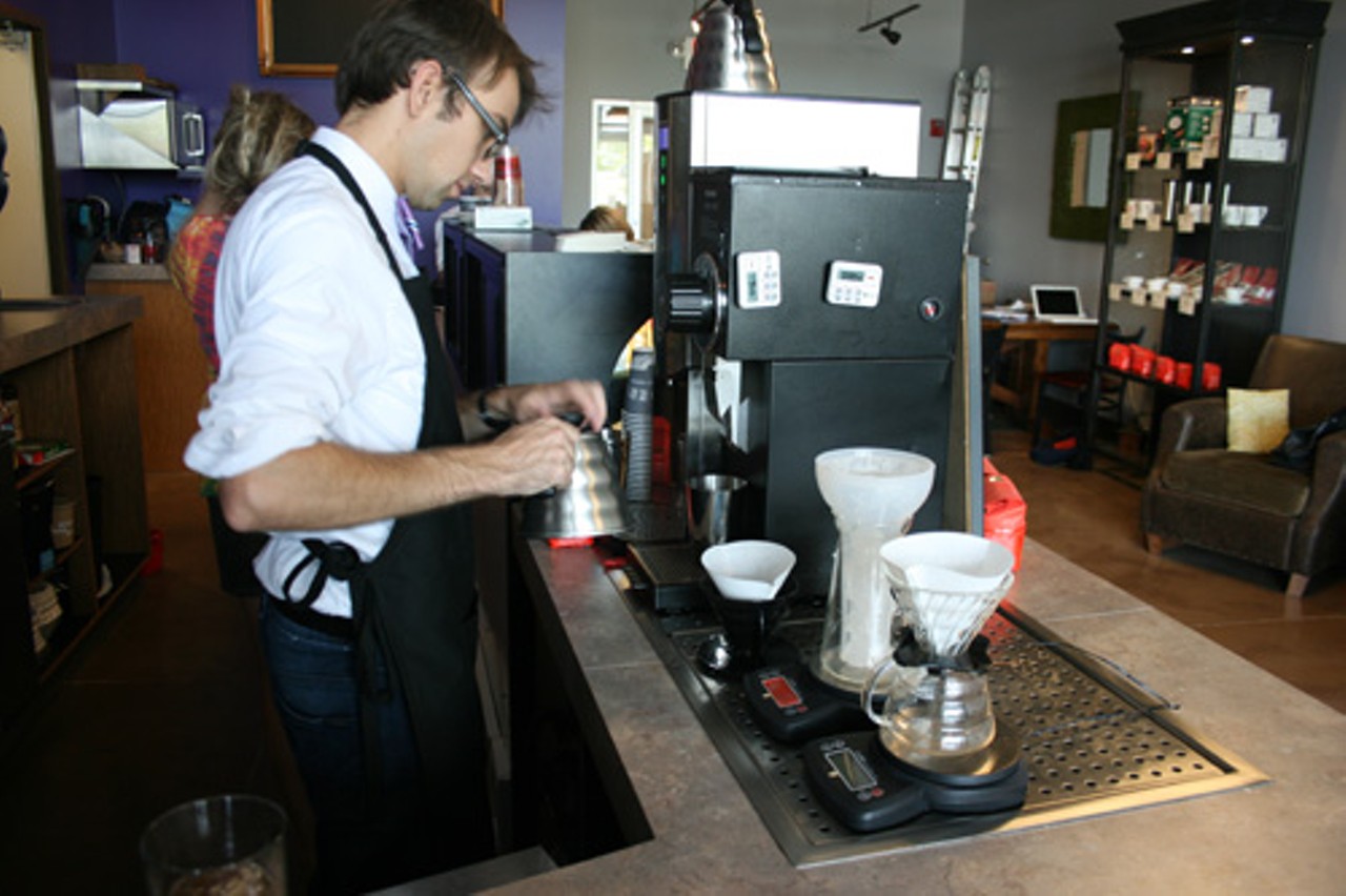 Owner Mark Attwood prepares to flash-brew coffee.