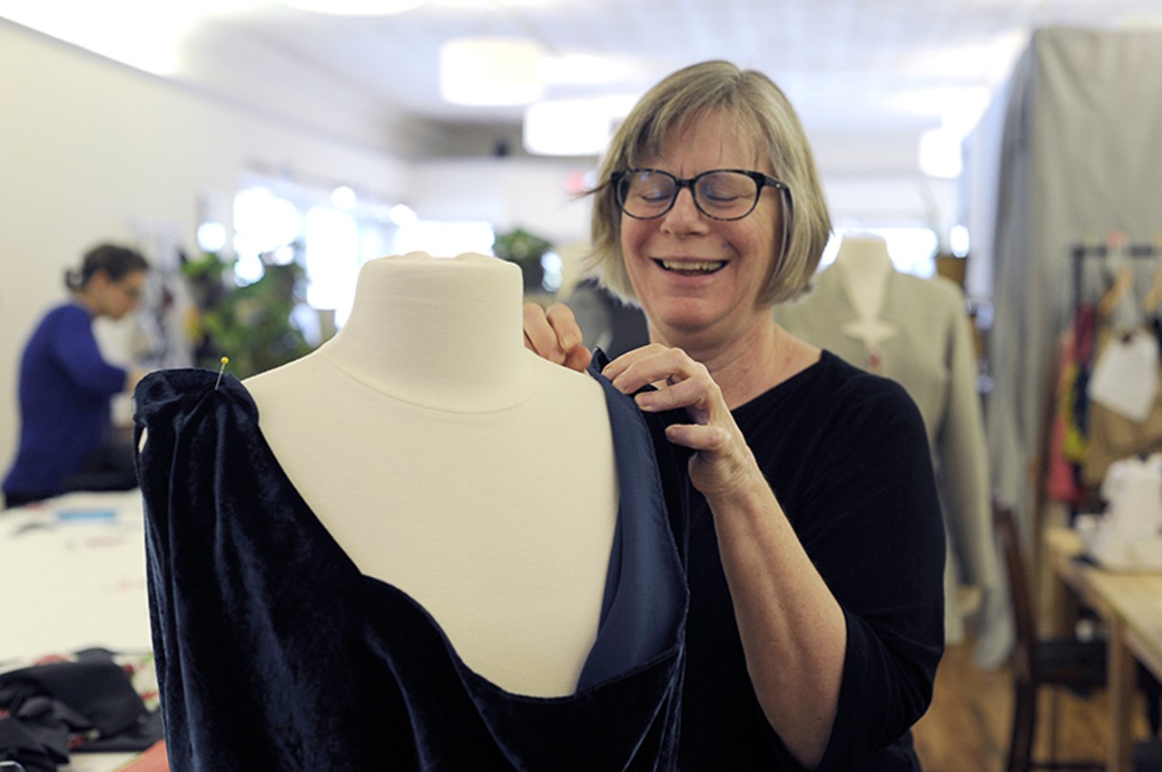 Shop co-owner Dorothy Jones pins a dress. Photo by Kelly Glueck