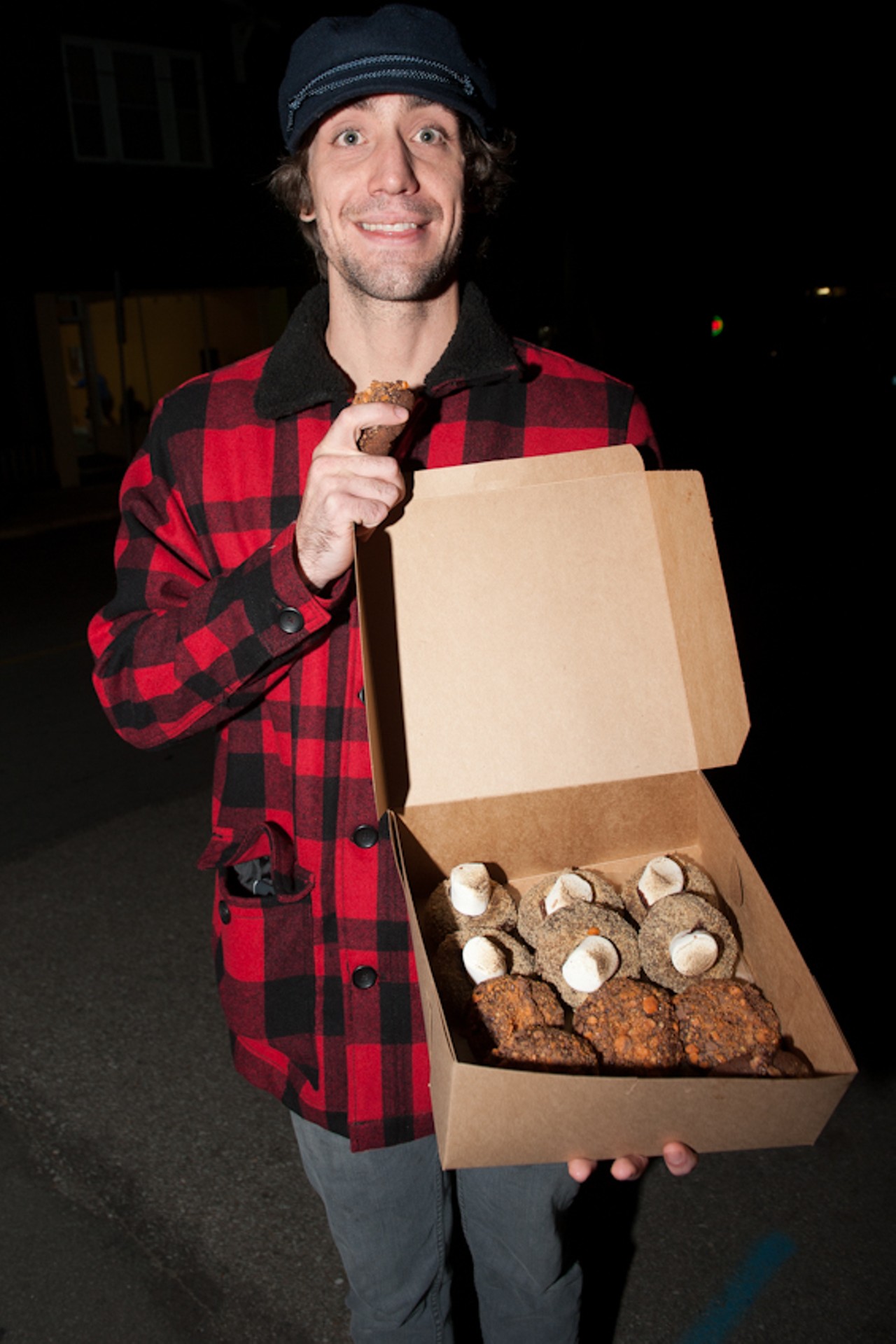 Argus Keppel of St. Louis shows off his purchase of 6 Bart's Revenge and 6 campfire donuts.