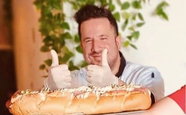 Lucciano Bacci, pictured with his two-foot-long Nightmare Dog, is on a mission to make the world's most expensive hot dog.