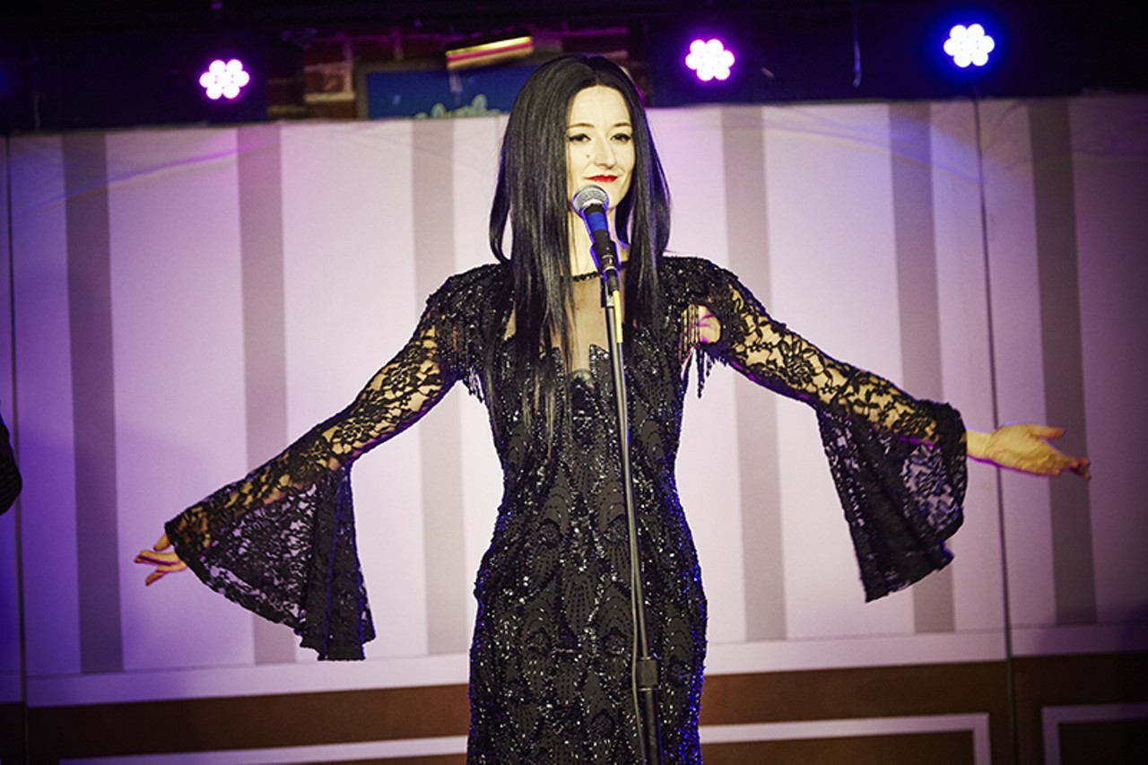 Morticia serenades the audience in French.