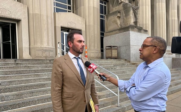 Attorney Chris Combs talks to the media after a bond hearing for his client, Grace Kipendo, who is accused of being part of a brutal kidnapping. Combs says his client is innocent.
