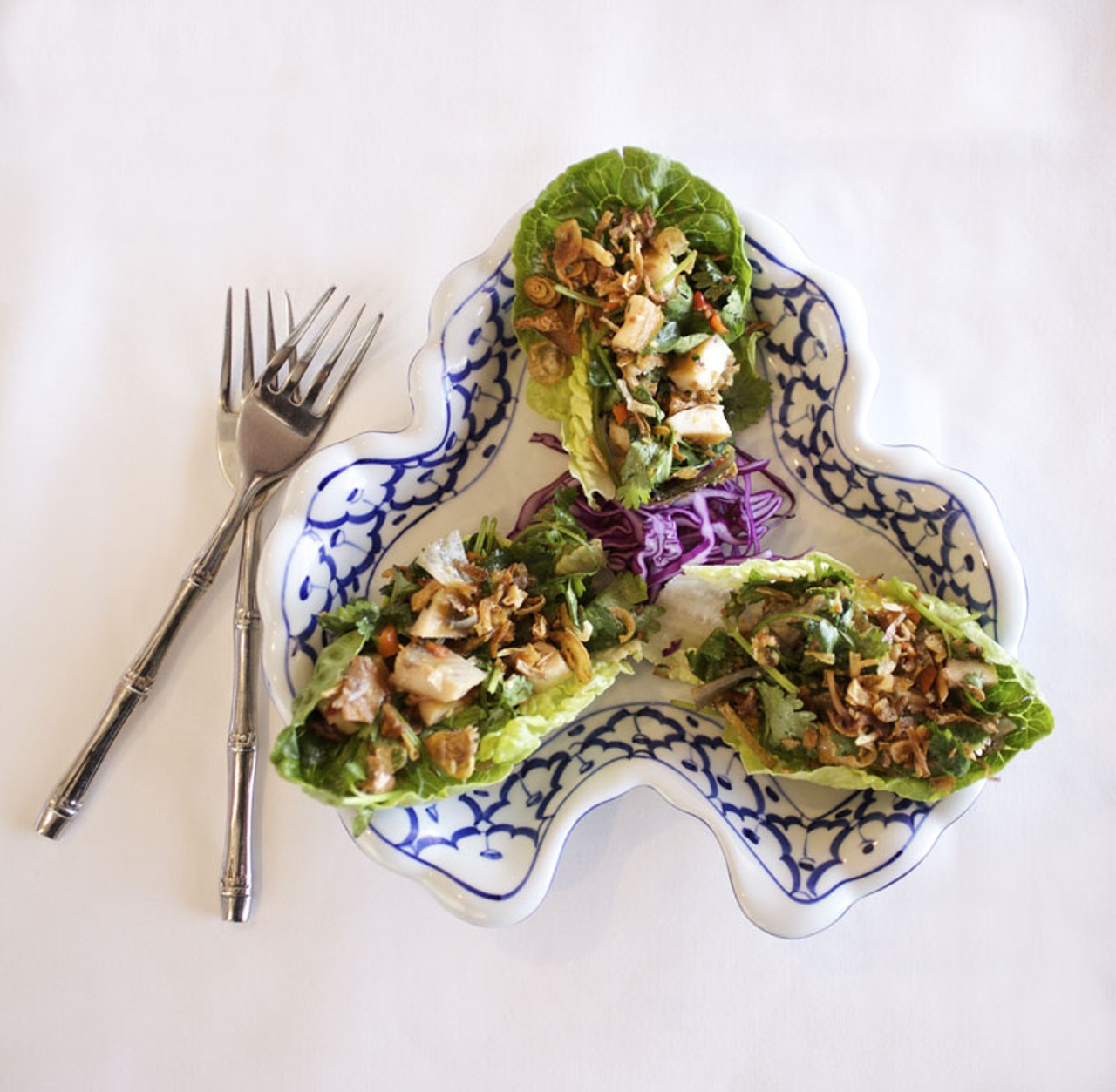 Miang of Smoked Trout is a "small snack" of flakes of smoked trout, cilanro, shallots and Southeast Asian herbs mixed with a Tai chutney on Bibb leaf lettuce.