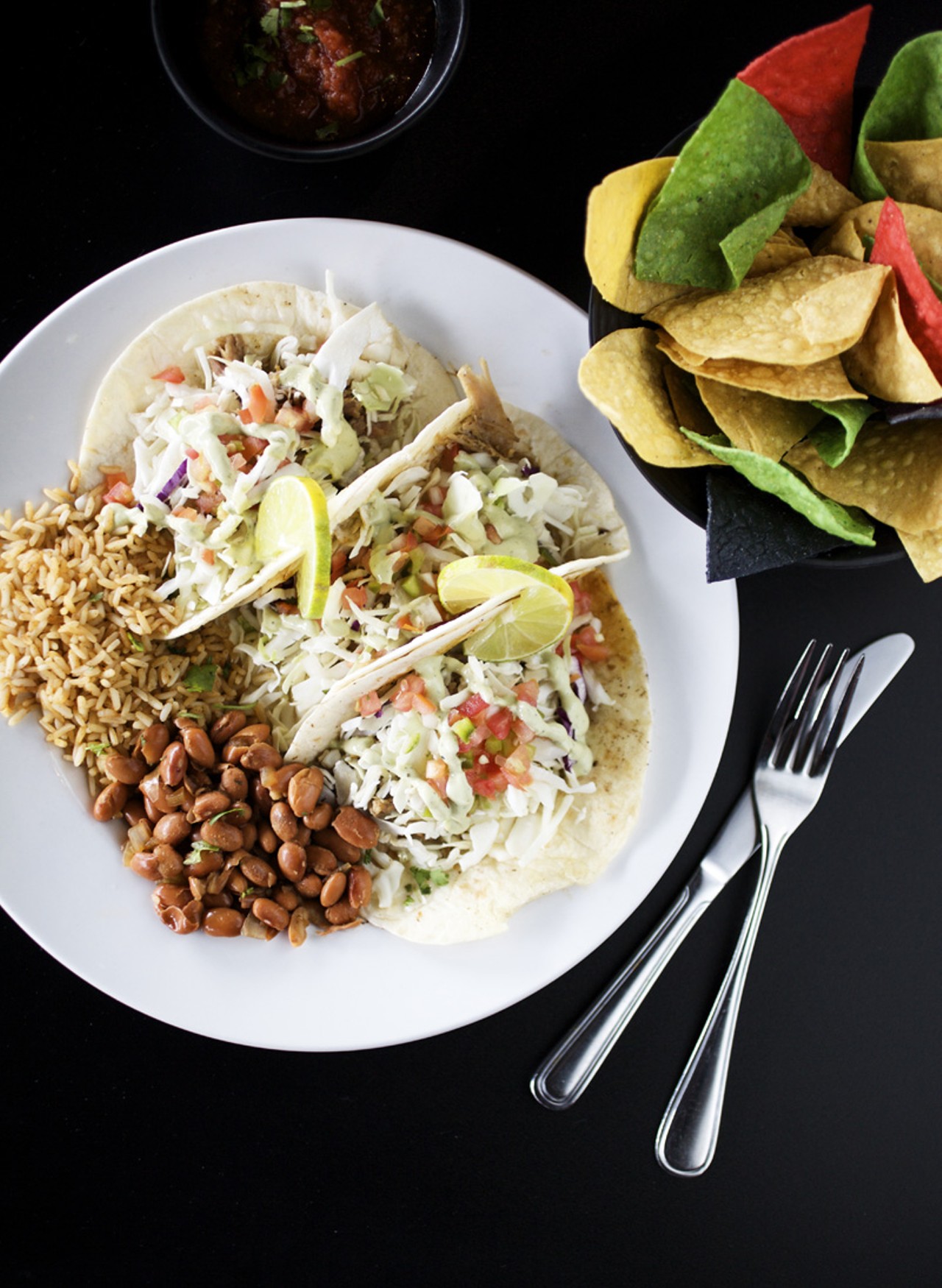 One of the house specialties listed on the menu is the fish, shrimp or crab cake soft tacos. They come served with Red's cheese blend, shredded cabbage, pico and cilantro lime cream.