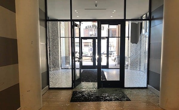 The glass was blown out at the front doors after a shooting at Ely Walker Lofts last March.