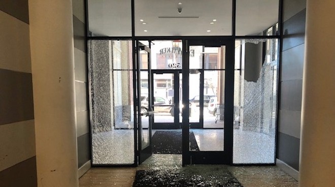 The glass was blown out at the front doors after a shooting at Ely Walker Lofts last March.