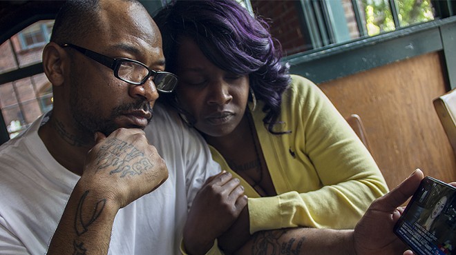 Danny Barnett and Nyeisha Muldrew watch a November KSDK news story of his arrest for the beating and robbery of Huan Le.