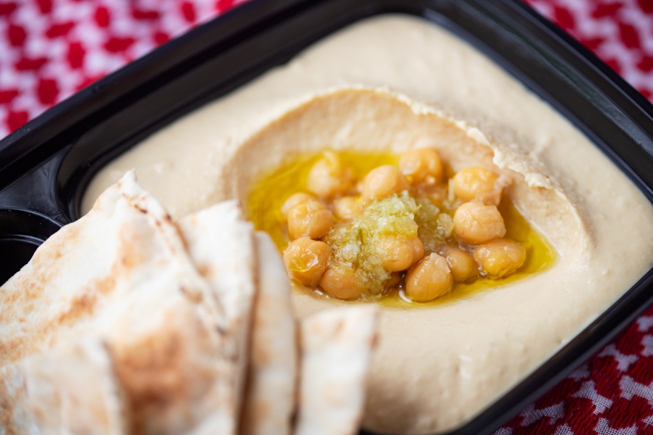 Hummus dip with a touch of extra virgin olive oil, served with pita.
