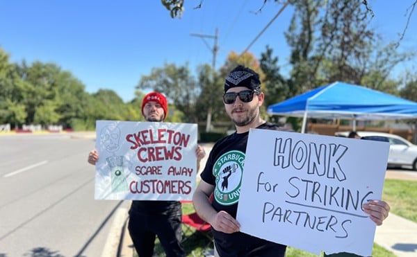 Workers at the Ladue Starbucks hold signs during a one-day strike last year. The store became the first in St. Louis to unionize last June.