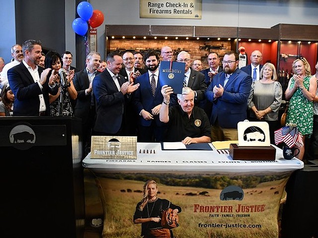 Gov. Mike Parson celebrates the signing of Missouri's "Second Amendment Preservation Act" at a gun range, because of course.