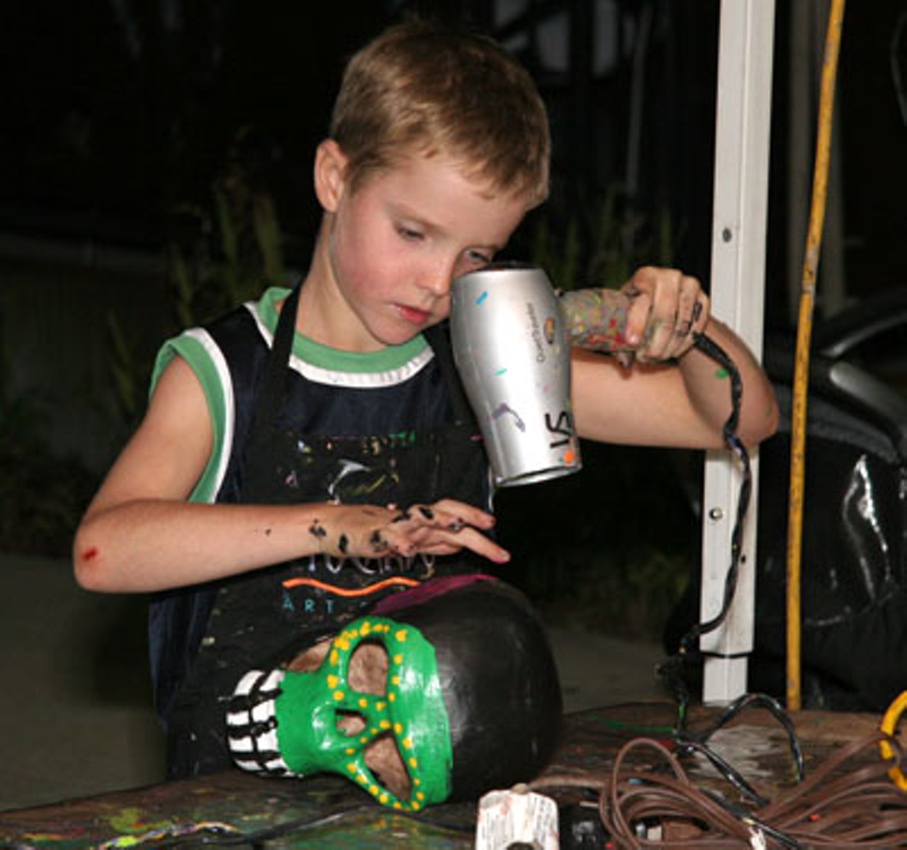 A child painting a Day of the Dead skull at Art Outside, Friday, September 5.