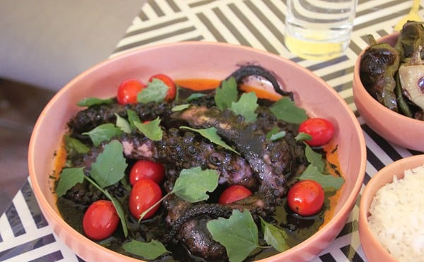 The pulpo en su tinta is an octopus braised in an ink sauce served with rice, roasted wax peppers and tortillas.