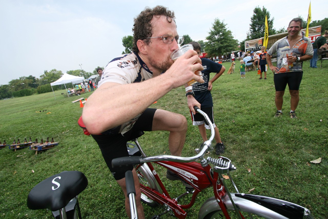 One of the winners of the New Belgium Urban Assault bike race: David Frei. He basks in glory as he drinks a New Belgium beer on his newly won Limited Edition New Belgium bike. See more photos from the race right here.