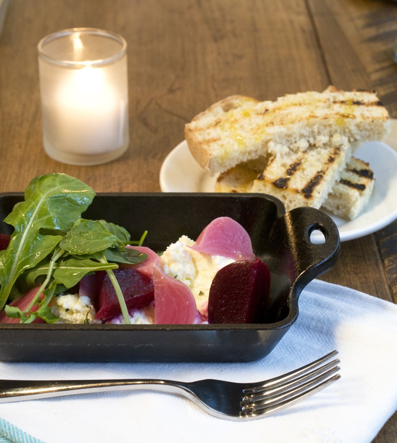 The ricotta and pickled beet small plate with ricotta made in-house from raw milk supplied by Greenwood Farms in Newburg, Missouri. The beets, arugula and thyme are sourced from St. Isidore Farms (pickling done in-house) in Moscow, Mills, Missouri.
