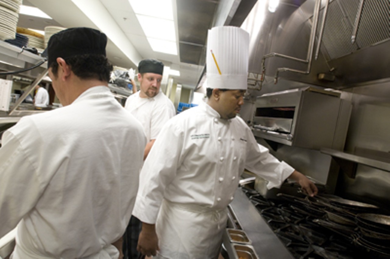 The active kitchen with (from left to right) Tello Carreon, line cook, Derek Holthouse, line cook and Operations Chef, Henry Watson.
