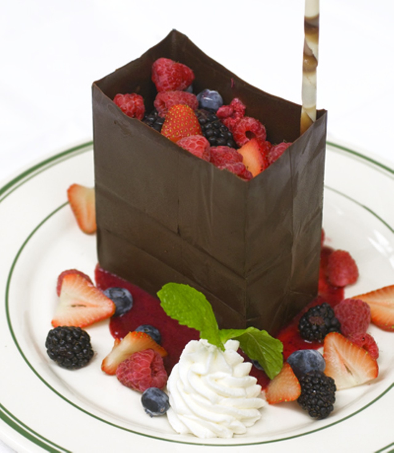 The chocolate bag served with mixed berries and white chocolate mousse.