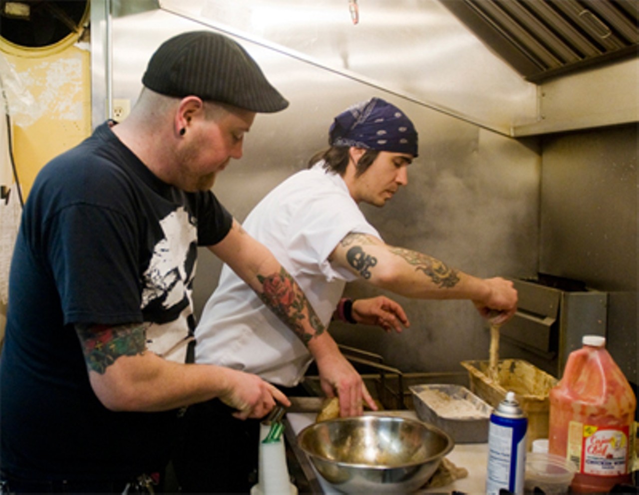 Jimmy Hippchen, left, cooks with chef Jaxon Noon. Read our review of the Bleeding Deacon by Ian Froeb.