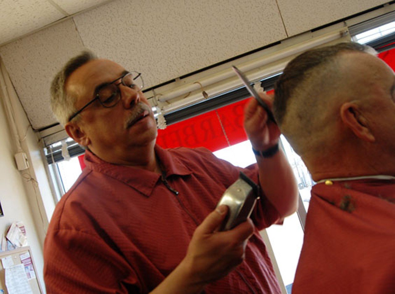 South Hampton Barber Shop (5423 Hampton Avenue) opened in 1955. Pictured is owner, Mark Hoffmann.