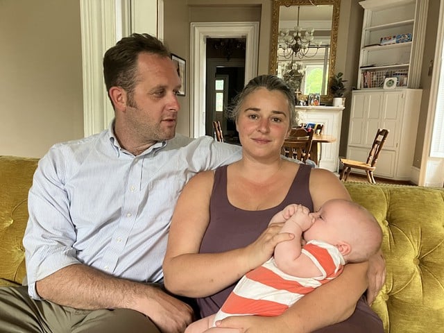 David, left, and Diane Nedvidek, with their youngest son, who was born in St. Louis.