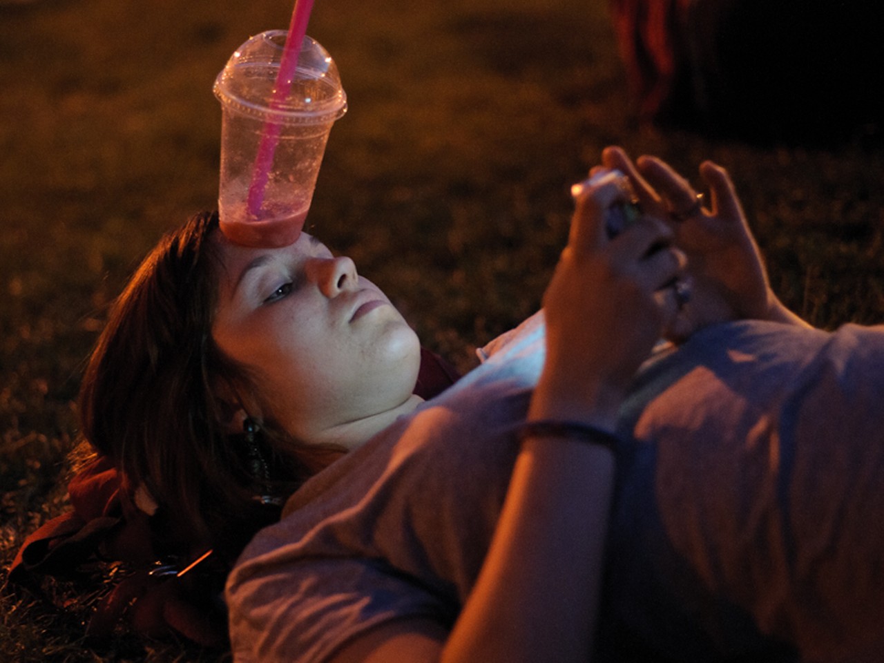 Hey, a girl's gotta put her smoothie somewhere while texting.