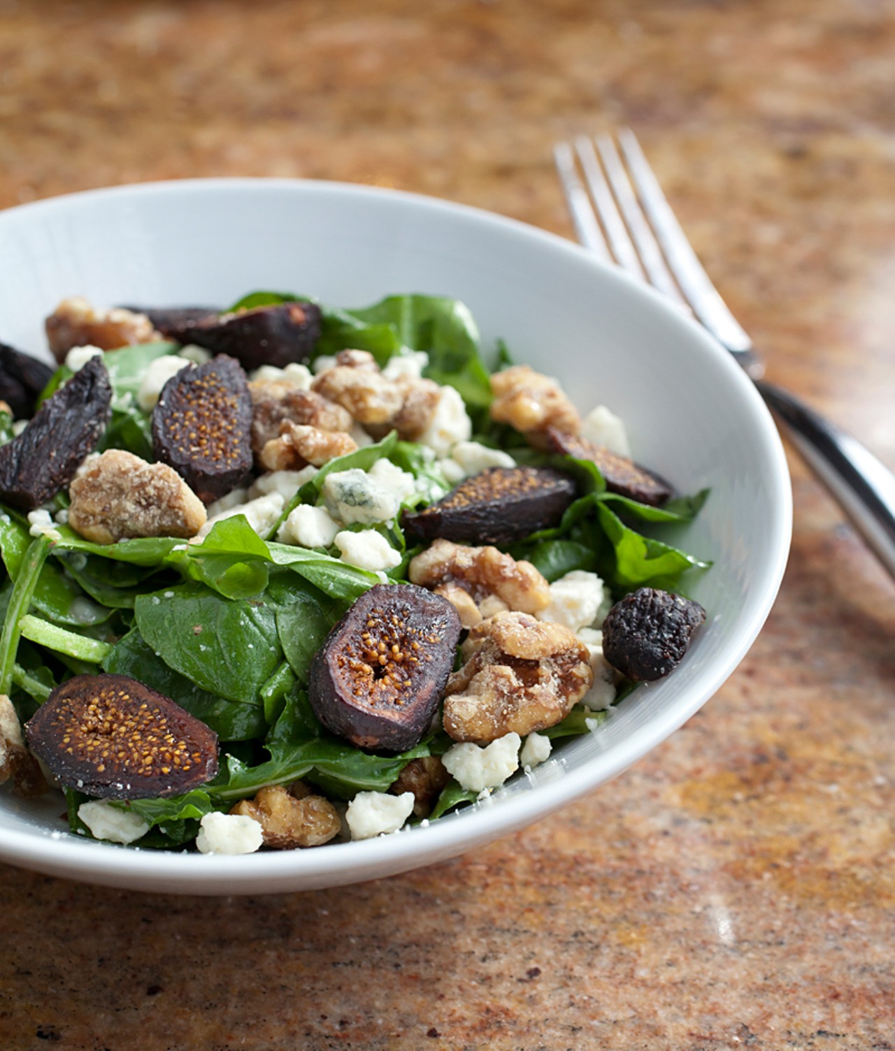 Spinach and arugula salad with figs, gorgonzola dolce, candied walnuts and sweet fennel vinaigrette.