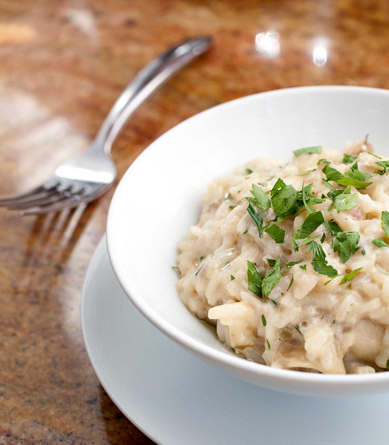 Wild mushroom risotto with mascarpone, parmesan cheese and herbs finished with truffle oil.