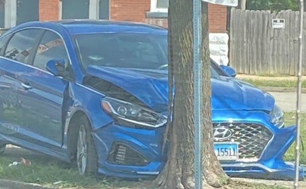 A Hyundai Sonata sits abandoned after being crashed into a tree in St. Louis city.