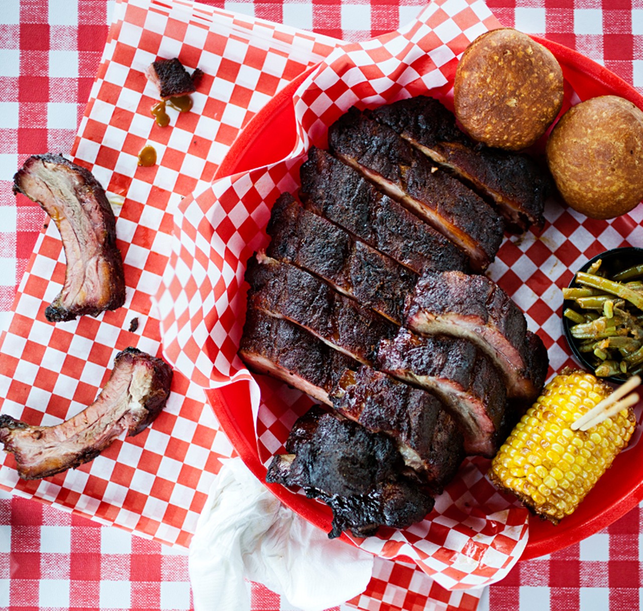 Full slab of ribs with fried biscuits, fried corn and green beans.