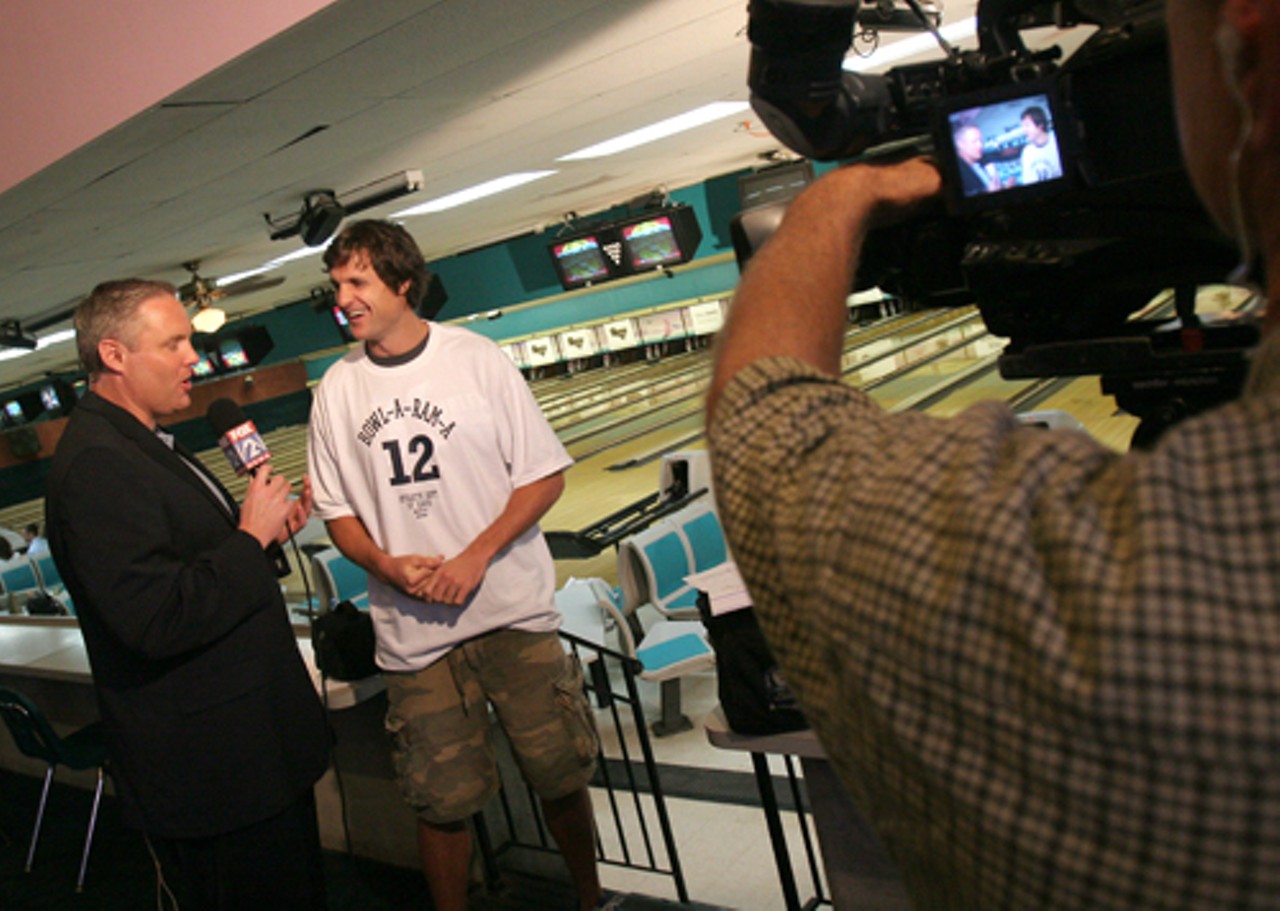 Martin Kilcoyne, KTVI-TV sports director, interviews event co-chairman and Rams wide receiver Drew Bennett about the Epilepsy Foundation of St. Louis and the twelfth annual Bowl-a-RAM-a event.