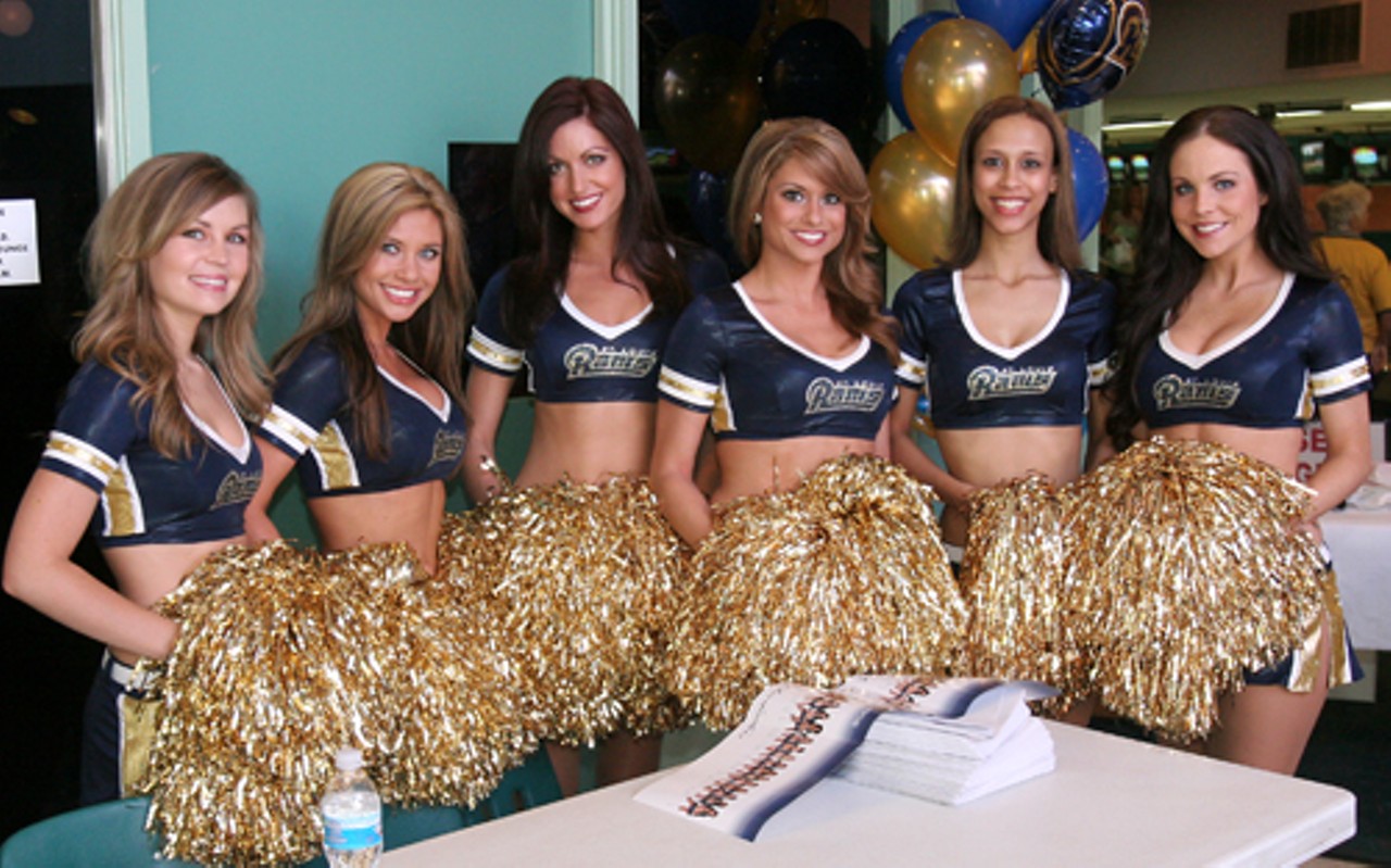 The Rams cheerleaders signed autographs.