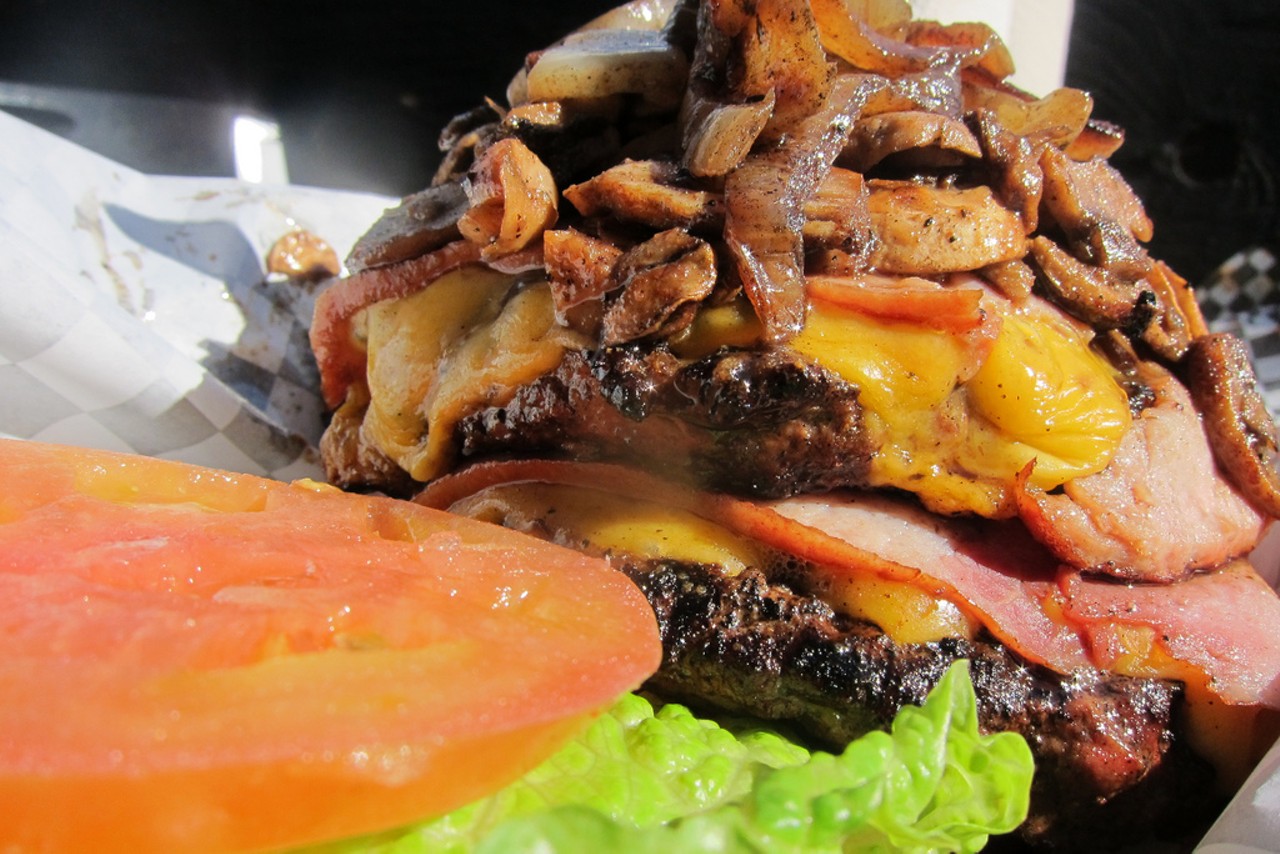 Source: Los Angeles
Where: The Cardiac Burger, The Bucket
The Bucket in Los Angeles is probably most (in)famous for its Cardiac Burger. A heap of greasy onions and mushrooms piled atop bacon, grilled ham and two massive 1/2-pound beef patties.
Read more on the LA Weekly: 30 Days of Burgers