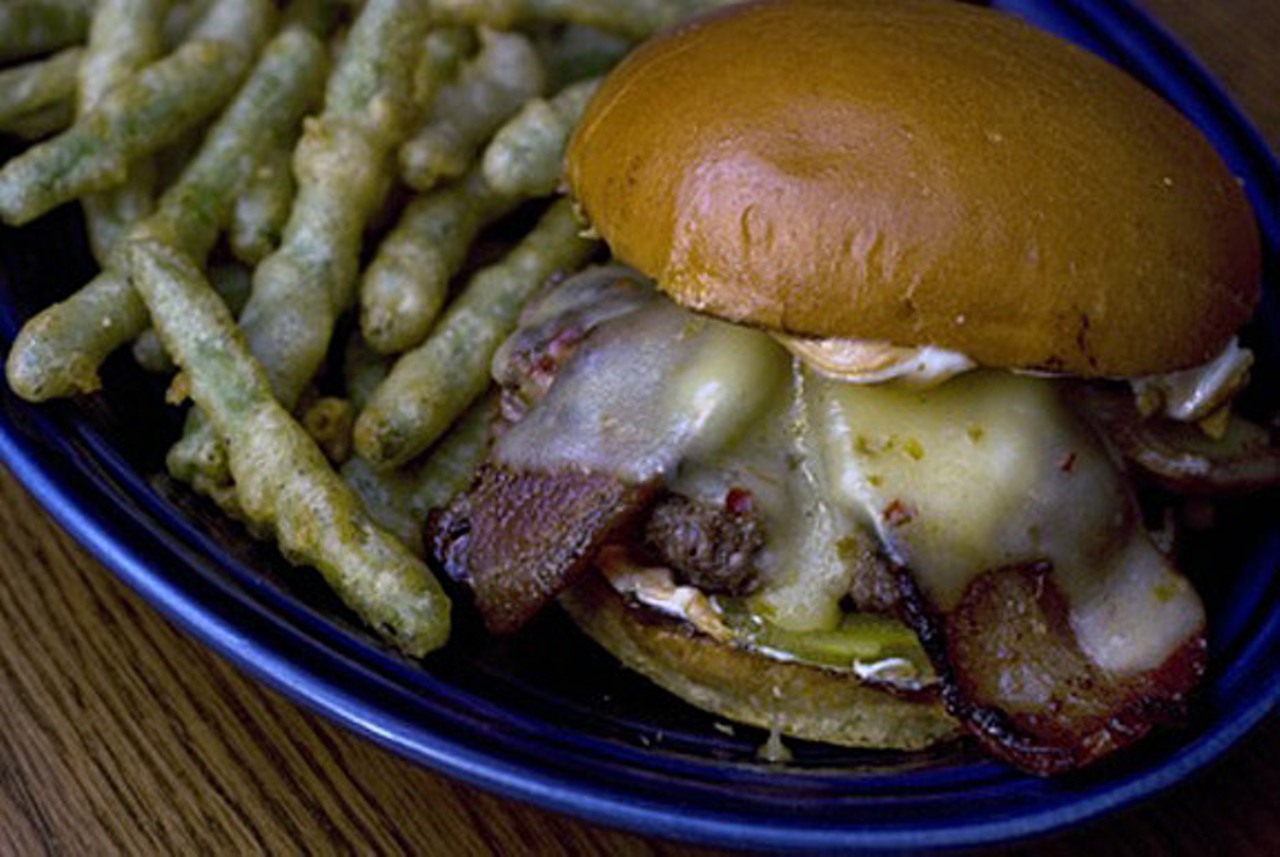 Source: Minneapolis
Where: Blue Door Pub
Doesn't look too appetizing, does it? Well, wait till we tell you its secret ingredient and you'll think it's even worse: peanut butter. &nbsp;The improbable combination works in the same way Asian cuisine pairs beef with peanut sauce: nutty meets meaty, plus smoky bacon and pepper jack cheese means a rich, savory indulgence like no other among the Twin Cities burger scene. Read more on City Pages: Blue Door Pub's Jiffy Burger: 100 Favorite Dishes