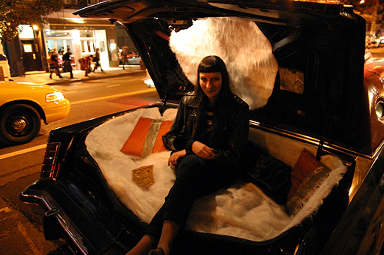 Corinna Mantlo of Team "Cookin' With Gas sits in the plush trunk of the Mark V in New York.
