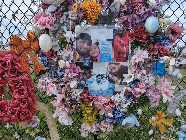 A memorial to Dmyah Fleming, and her father, Darrion, on Laclede Avenue.