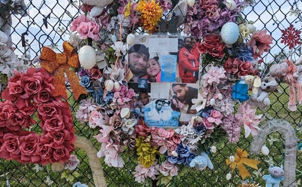 A memorial to Dmyah Fleming, and her father, Darrion, on Laclede Avenue.