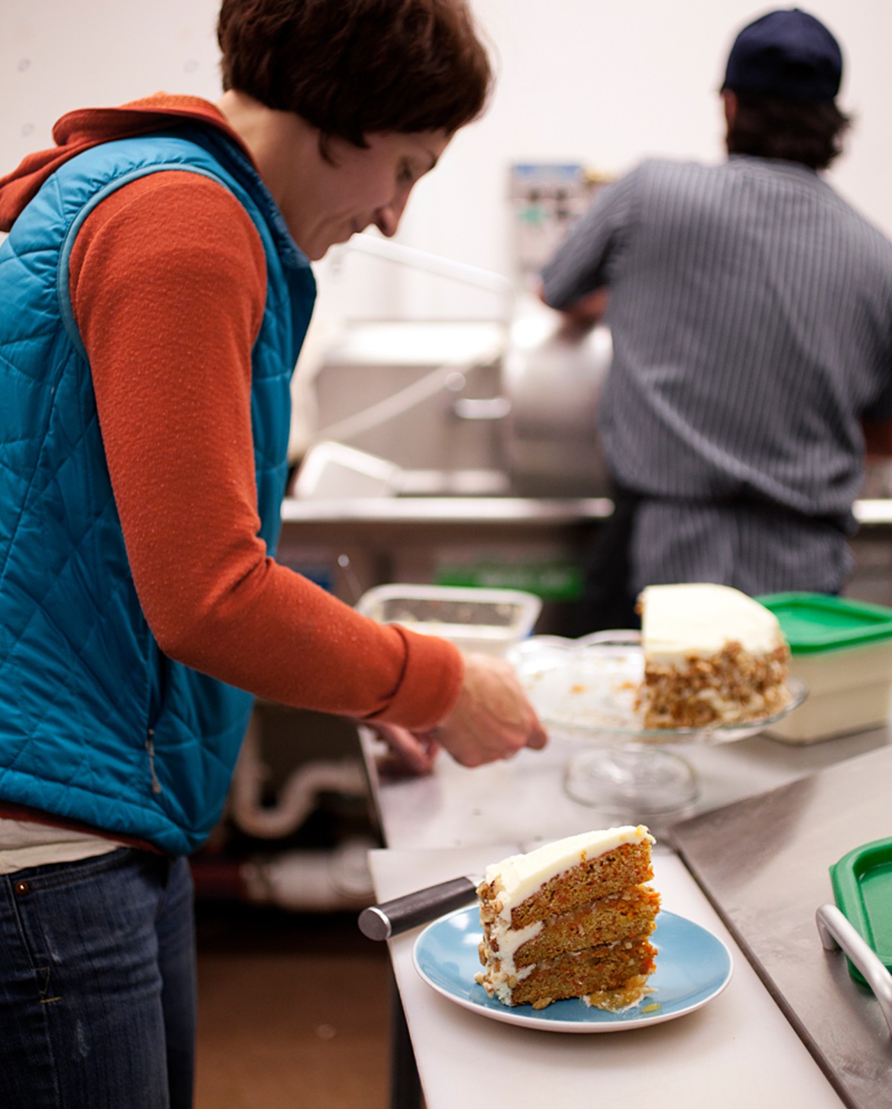 Owner Jenny Cleveland prepares a slice of carrot cake.