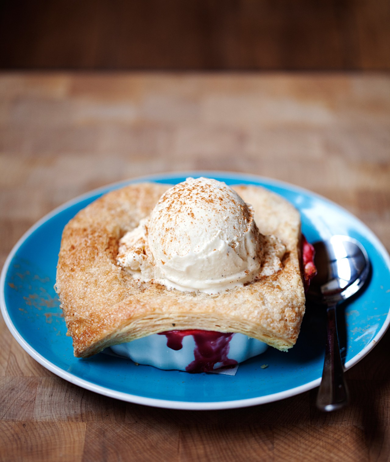 The Old-Fashioned Cherry Pie is made with tart pie cherries, a butter crust and is served with vanilla ice cream.