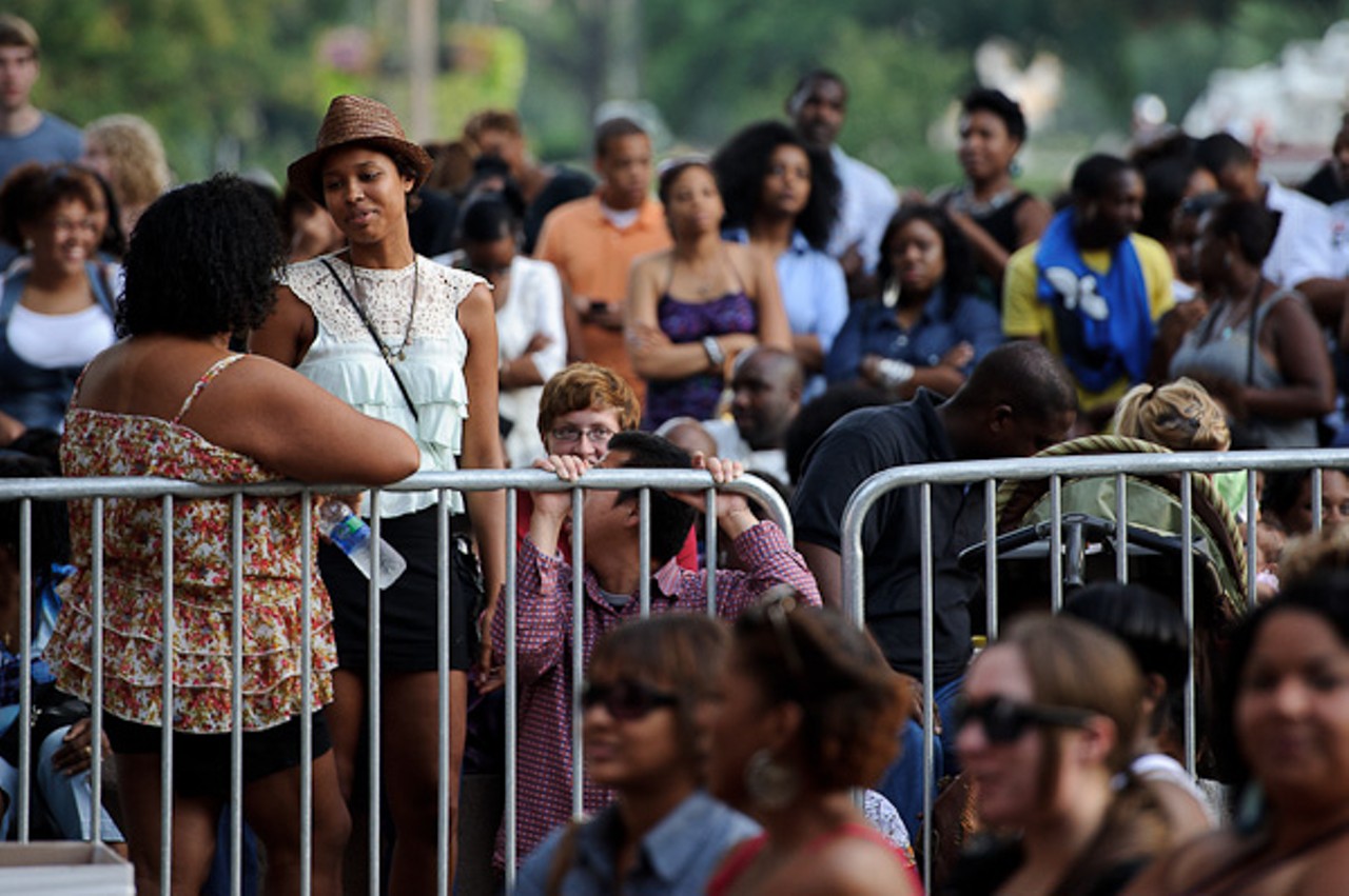 Fans await the start of the Common show at Soldiers Memorial Park in St. Louis.