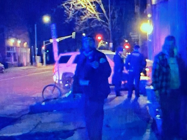 This still from a video shot by bystander Matt Pfaff shows St. Louis Police on the scene at Bar:PM. The officer facing the camera has been identified as the one who gave the bar's co-owner a black eye.