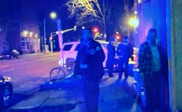 This still from a video shot by bystander Matt Pfaff shows St. Louis Police on the scene at Bar:PM. The officer facing the camera has been identified as the one who gave the bar's co-owner a black eye.