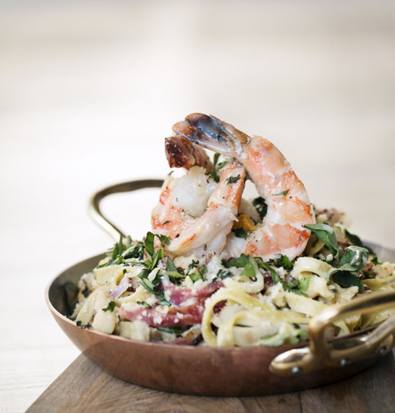 The "Linguini with Shrimp & Clams" is made with soppressata and hot chile flakes.