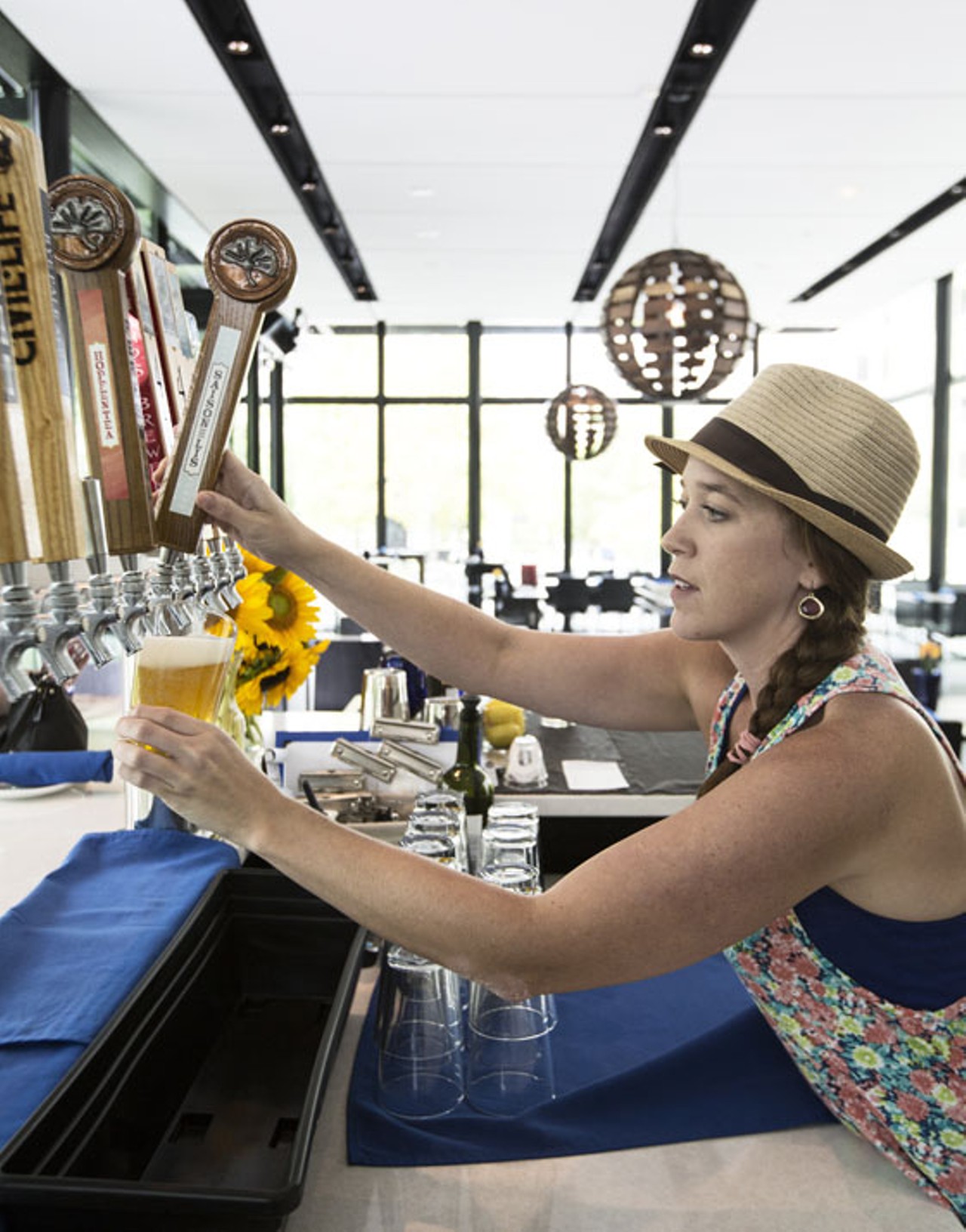 Bartender Kelsey Zehner pours Perennial's Saison de Lis.
