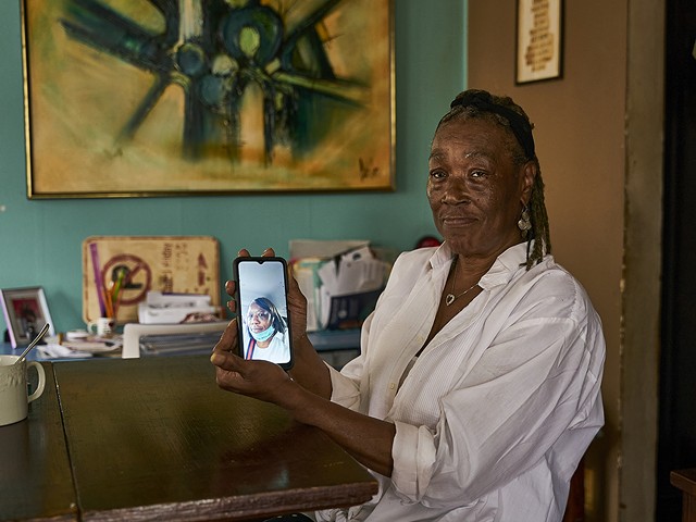 Carolyn Reed with an image of her daughter Chuny Ann Reed, who died in prison.