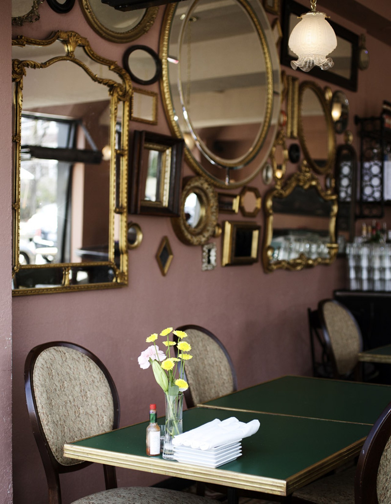 The interior of the Demun Oyster Bar has an intimate Parisian feel. The floor (vintage circa 1880) was imported from France, while the mirrors and bar are local touches.