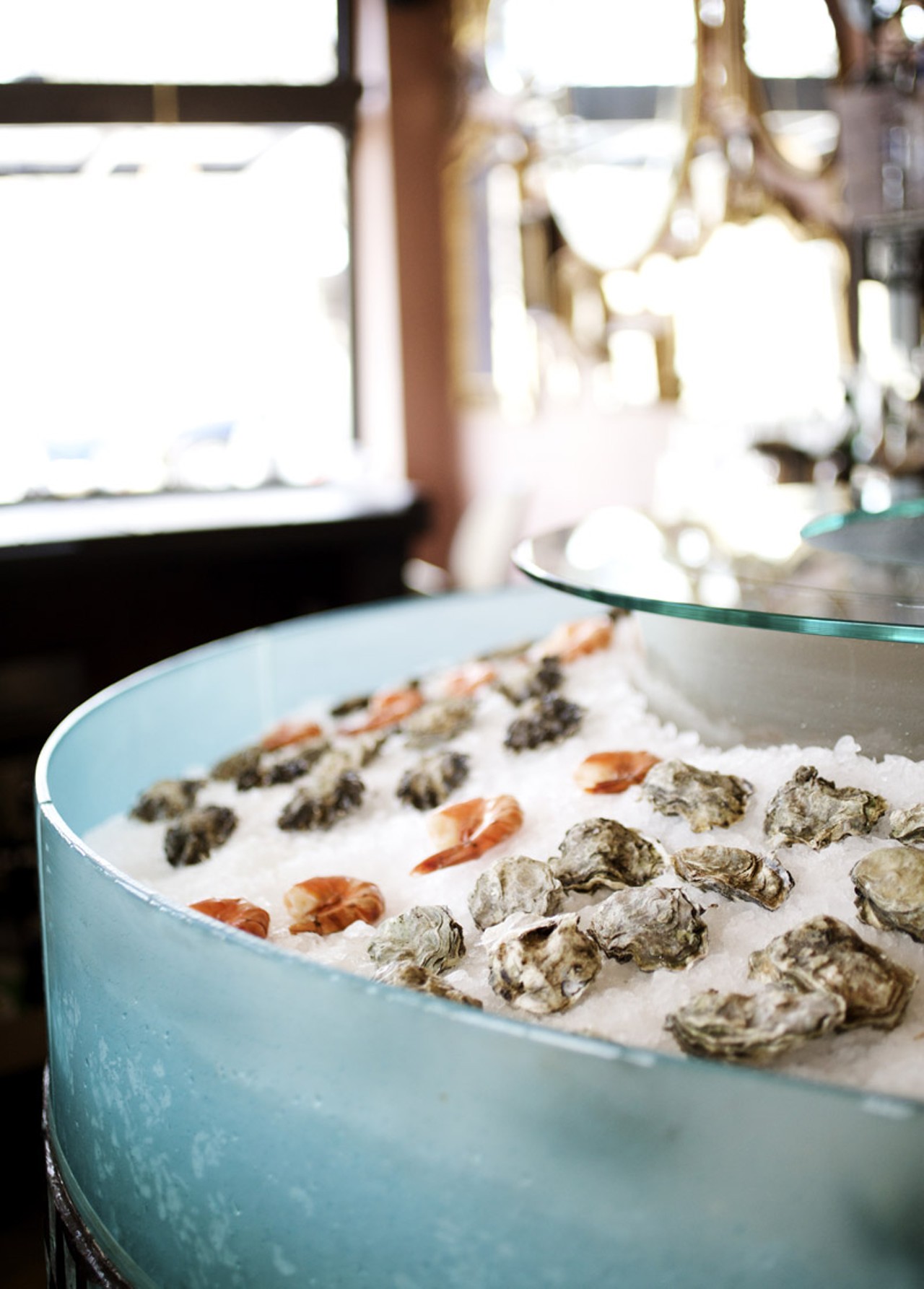 The oysters (and shrimp) at the shucking station, front and center behind the bar.