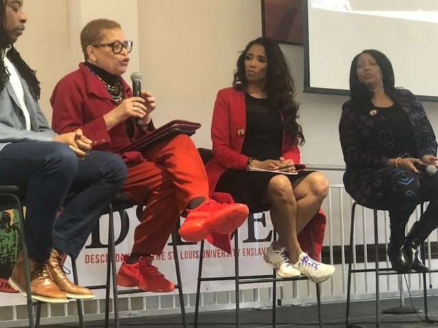 Robin Proudie (right) and attorney Areva Martin (second from right) listen to Dr. Julianne Malveaux, a former college president and board member of the National African American Reparations Commission.