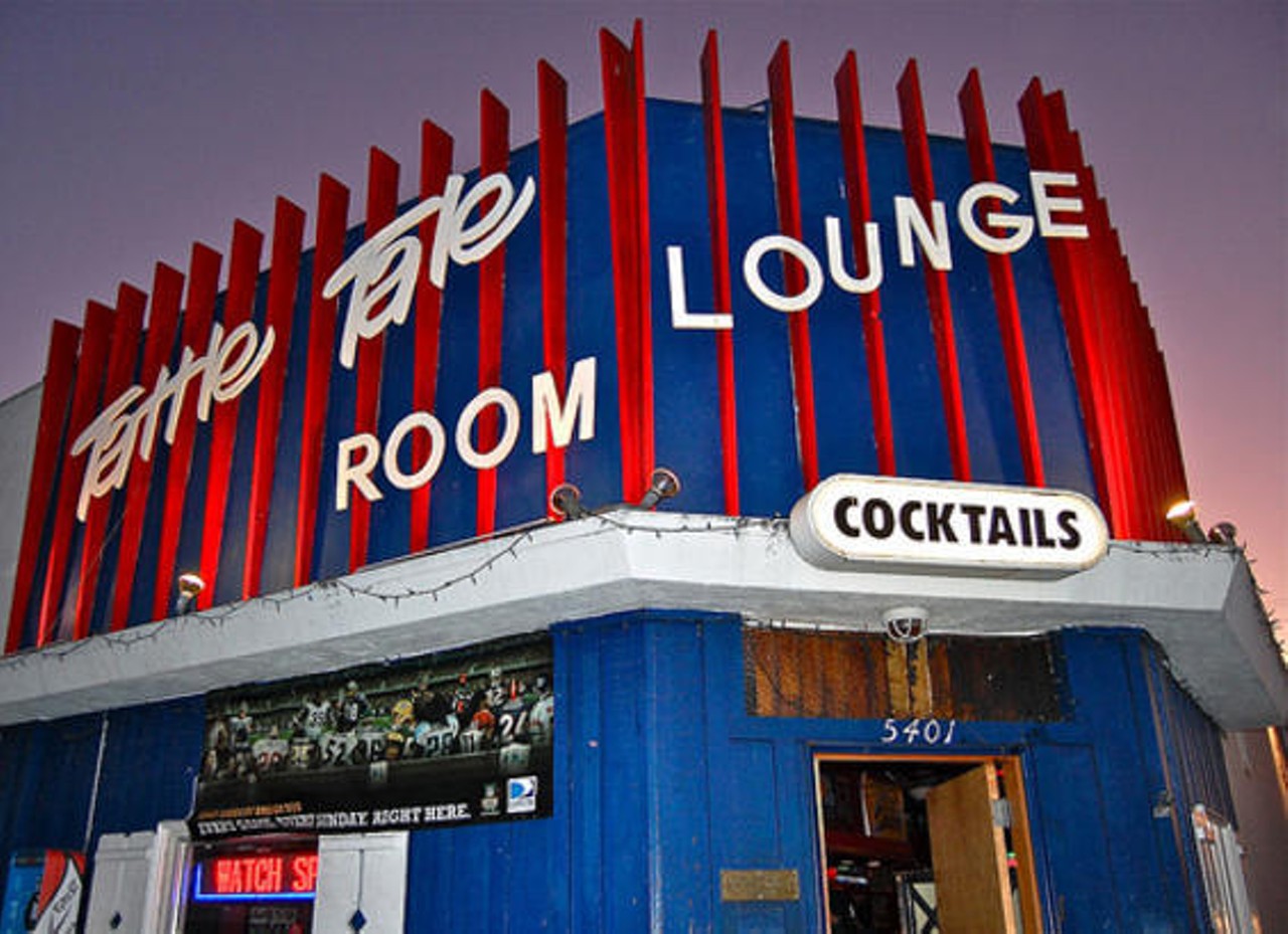 Often "Lounge" will be in the title of the bar.  
Tattle Tale Lounge in Culver City, California.