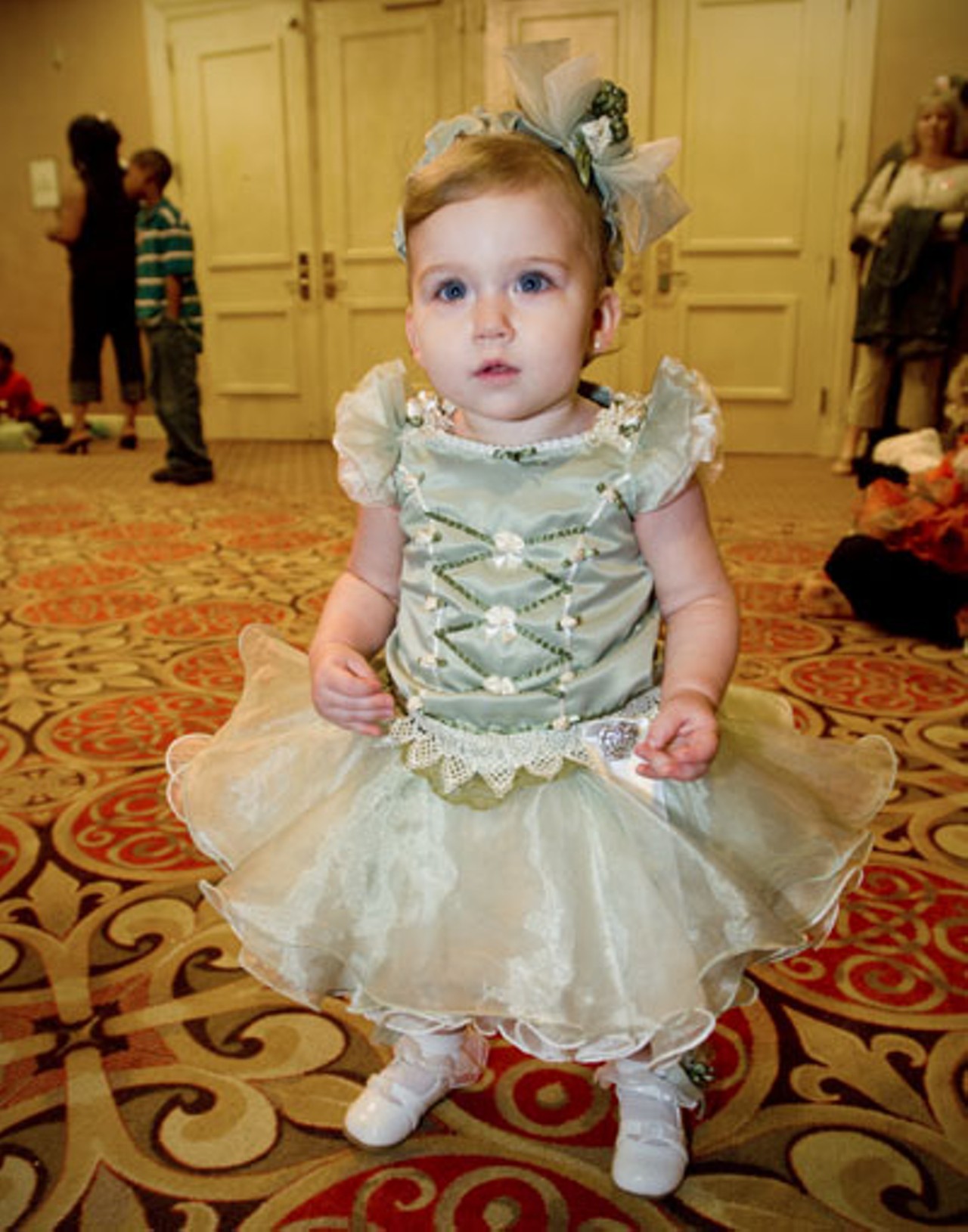 Alexyss Raine-Marie Keener from LaGrange, Indiana. Fourteen-months-old and wearing a dress her grandmother made. Some baby dresses can be found on eBay for the bargain price of around $600. New ones for your little one can cost as much as $1,000.
