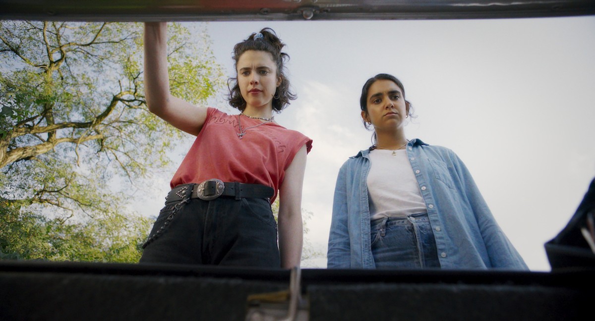 Margaret Qually and Geraldine Viswanathan eye the MacGuffin in the trunk.